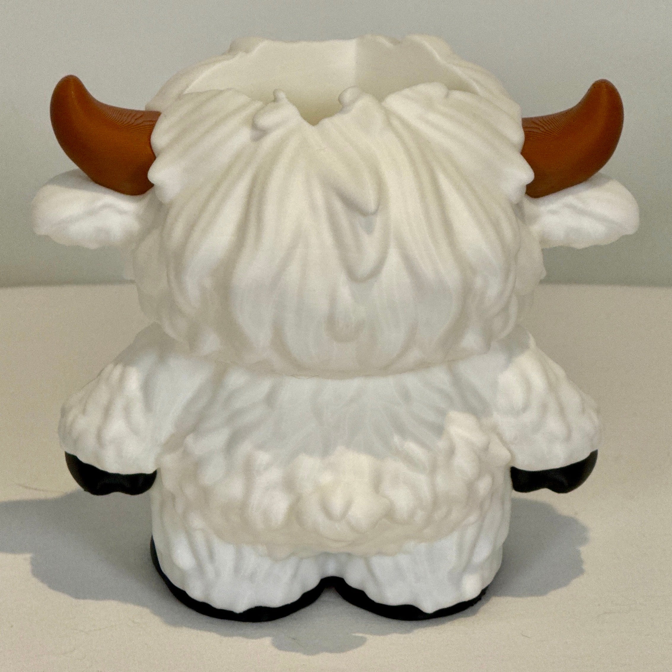 white Highland cow soap bottle holder. Rear view