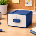 Blue and white storage box on a desk with office supplies