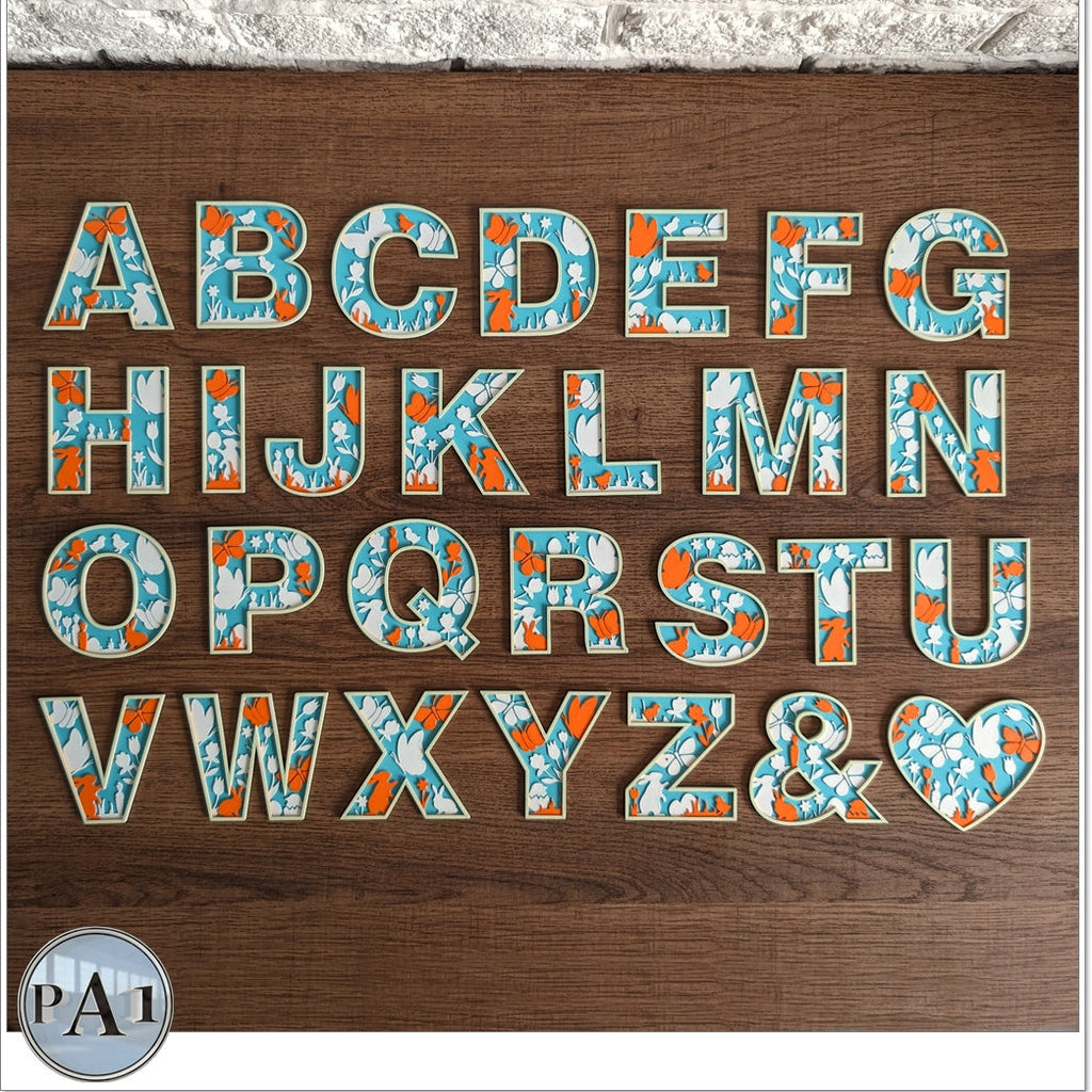 Alphabet letters on a wooden background with decorative patterns