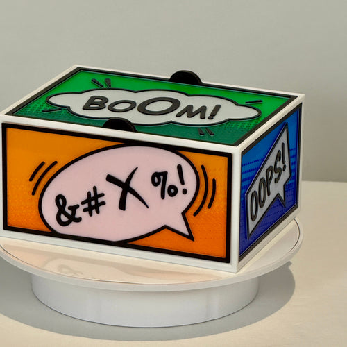 Decorative box with colorful speech bubble designs on a white surface