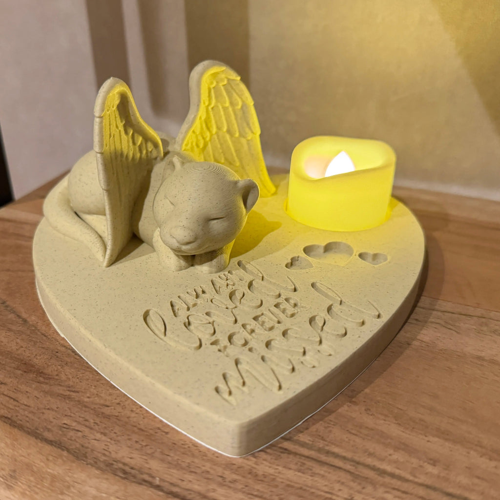Decorative heart-shaped candle holder with a ferret with Angel wings on a wooden surface