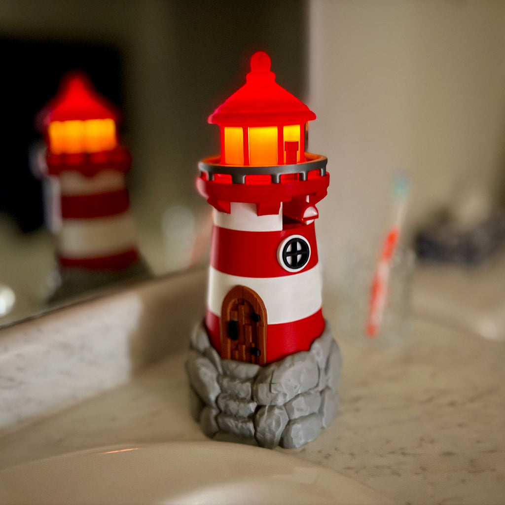 lighthouse soap bottle holder on a bathroom counter