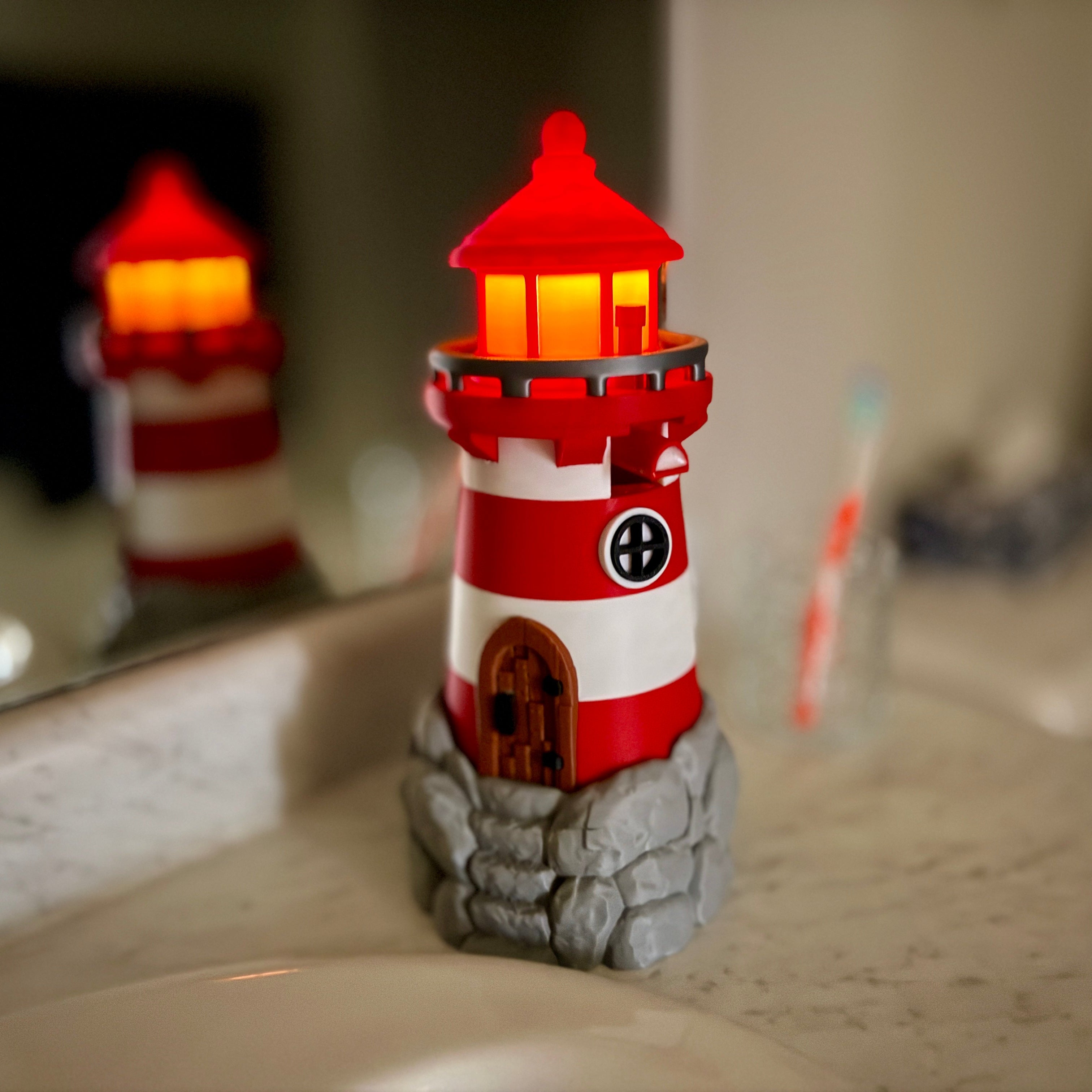 lighthouse soap bottle holder on a bathroom counter