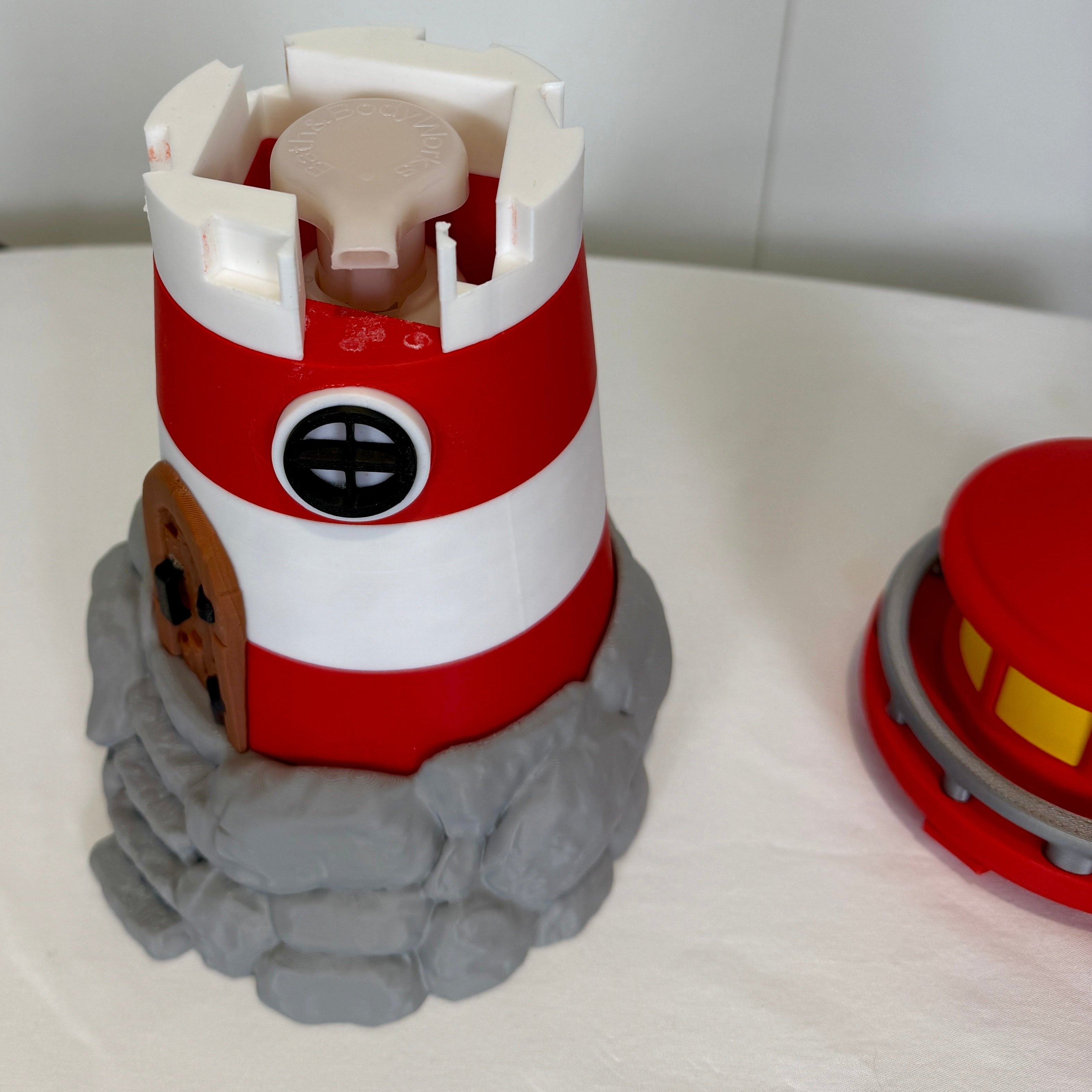lighthouse soap bottle holder with the top removed