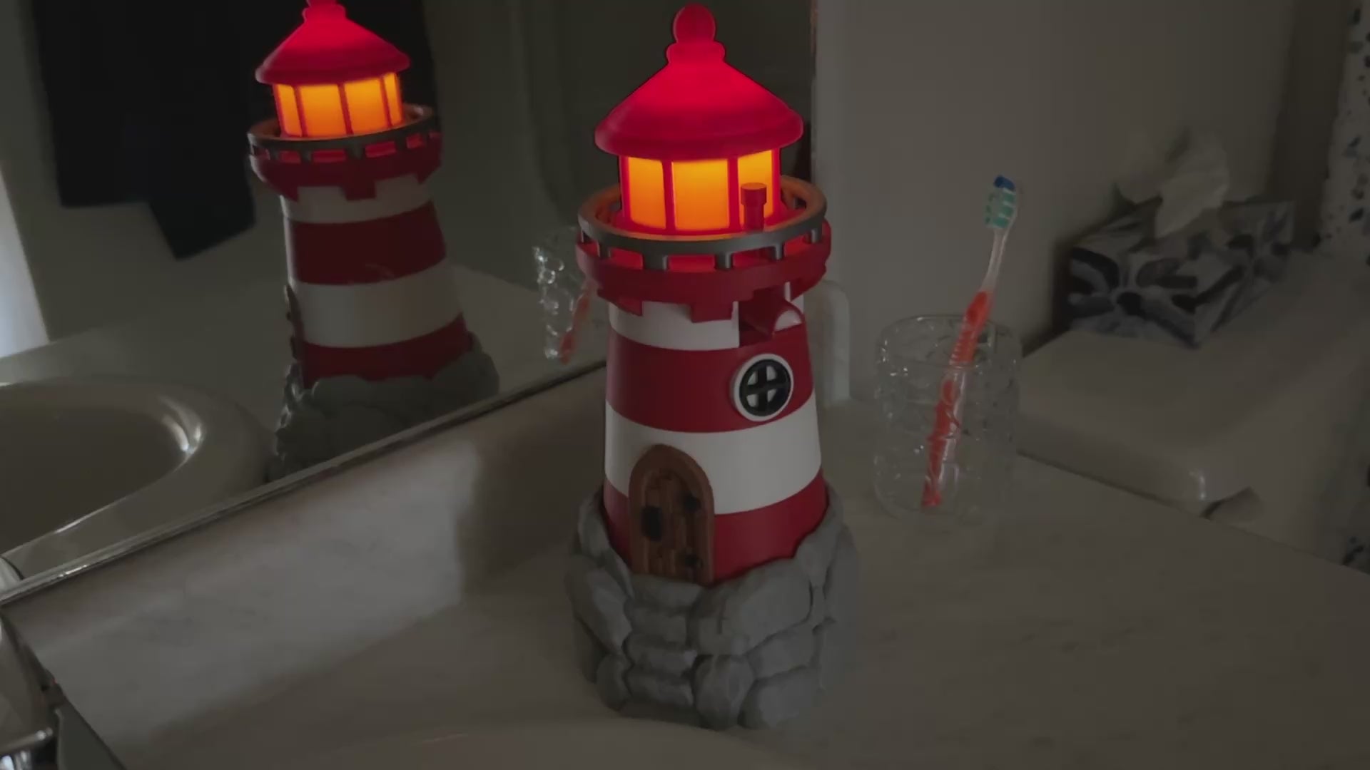 video of a lighthouse soap bottle holder With Tea Light Lighting the top