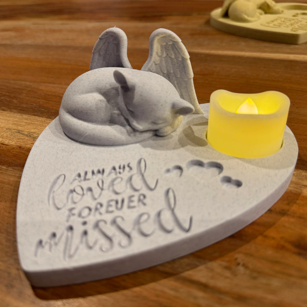 Memorial plaque featuring a Sugar Glider with angel wings, candle, and 'Always Loved Forever Missed' text on a wooden surface.